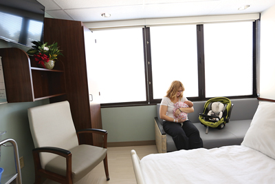 Just before being discharged, a new mother holds her baby during her stay in a mother-baby unit at The Women’s Hospital at Henrico Doctors’ Hospital.