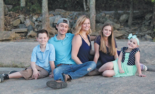 Jamie Perkins with Sawyer with all the kids: Ace, Dylan, Jamie in the middle, Madison, and Sawyer. “My family has been in two different cities for the past two years. I’m 720 miles away from the rest of my children,” says Jamie. “It’s heart-wrenching.”