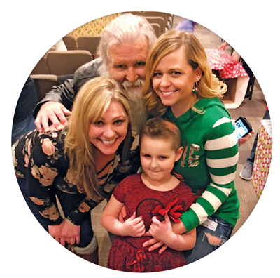 Over the holidays, Sawyer hosted a collection box-wrapping event for Mason’s Toy Box, an organization Kelly Kassay (left) founded to help Central Virginia families with kids who will spend the holidays in the hospital.